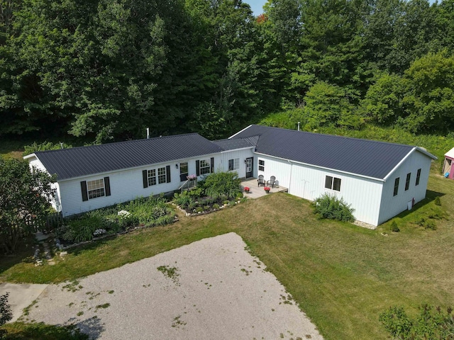 457 N Garfield, Traverse City, MI 49696 - view of front of home with a front yard, a metal roof, and a patio area