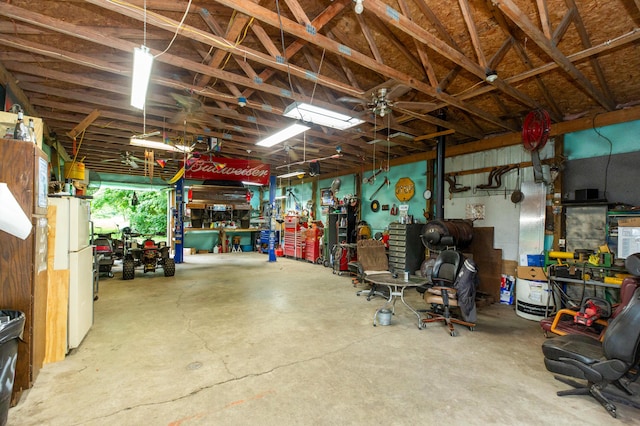 2314 Hand Rd, Niles, MI 49120 - garage with freestanding refrigerator and a workshop area