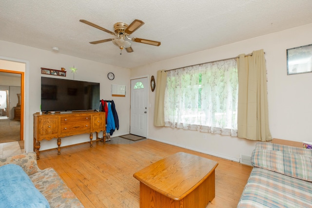 2314 Hand Rd, Niles, MI 49120 - living room featuring a ceiling fan, hardwood / wood-style floors, and a textured ceiling