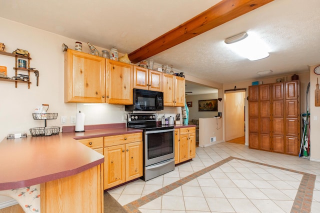 2314 Hand Rd, Niles, MI 49120 - kitchen featuring black microwave, stainless steel electric range, light tile patterned floors, a barn door, and a peninsula