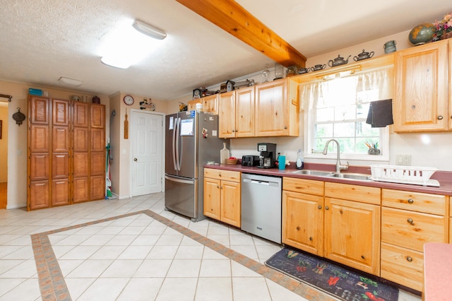 2314 Hand Rd, Niles, MI 49120 - kitchen featuring appliances with stainless steel finishes, light brown cabinets, light tile patterned flooring, and dark countertops