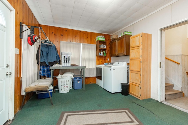 2314 Hand Rd, Niles, MI 49120 - laundry area with washing machine and dryer, carpet floors, wooden walls, and cabinet space