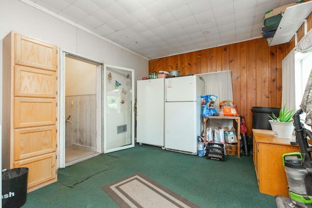 2314 Hand Rd, Niles, MI 49120 - kitchen featuring freestanding refrigerator, carpet floors, and wood walls