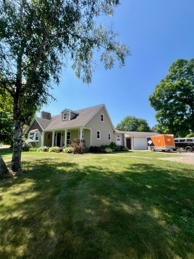 7220 W 64th St, Fremont, MI 49412 - view of front of home featuring a front yard and an attached garage