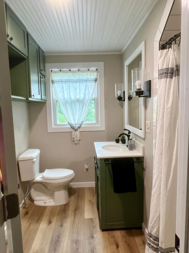 7220 W 64th St, Fremont, MI 49412 - full bathroom featuring vanity, wood finished floors, ornamental molding, and a shower with curtain