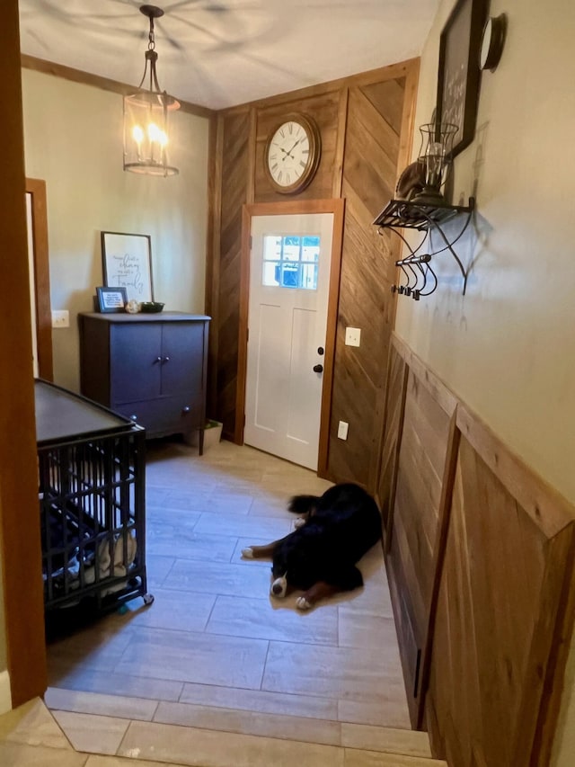 7220 W 64th St, Fremont, MI 49412 - foyer entrance with wood walls and wood finished floors