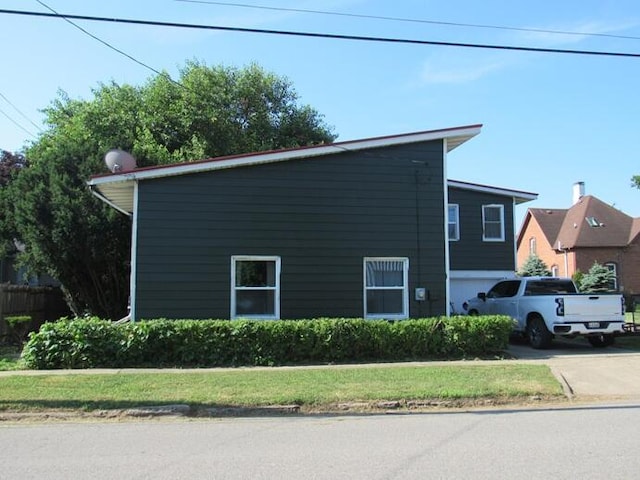 168 Fremont St, Bronson, MI 49028 - view of home's exterior featuring concrete driveway