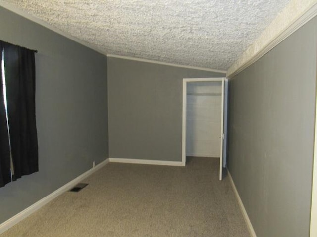 168 Fremont St, Bronson, MI 49028 - unfurnished bedroom featuring ornamental molding, carpet floors, a textured ceiling, and a closet