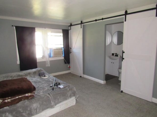 168 Fremont St, Bronson, MI 49028 - bedroom with a barn door, carpet floors, ornamental molding, cooling unit, and connected bathroom