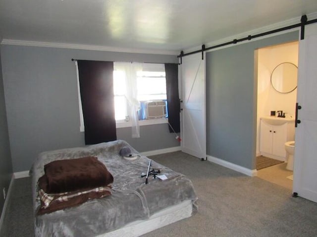 168 Fremont St, Bronson, MI 49028 - bedroom featuring a barn door, cooling unit, crown molding, carpet floors, and ensuite bathroom