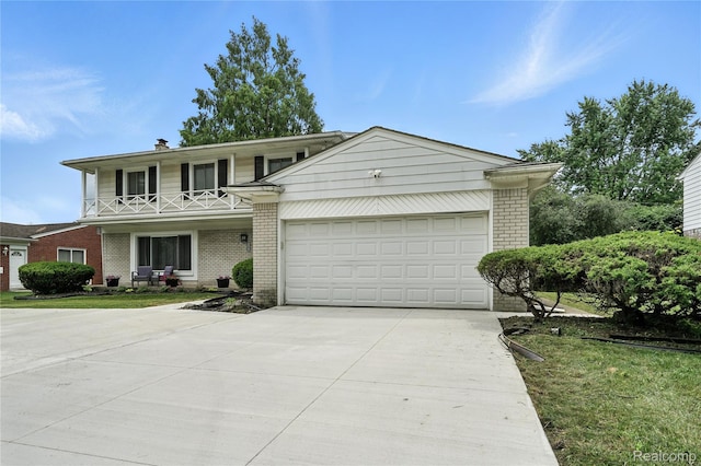 22679 Bell Brook St, Southfield, MI 48034 - view of front of property featuring brick siding, concrete driveway, a garage, and a chimney