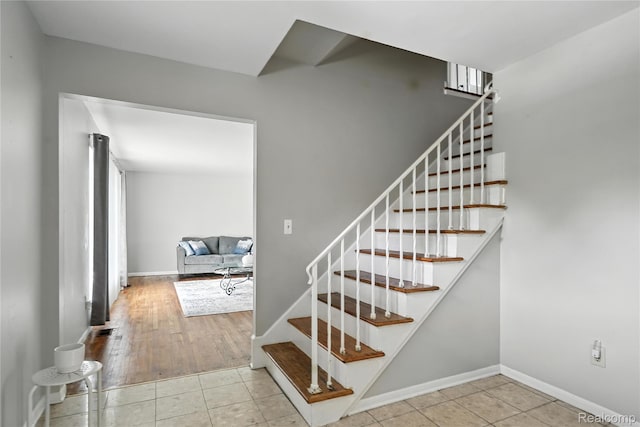 22679 Bell Brook St, Southfield, MI 48034 - staircase with baseboards and tile patterned floors