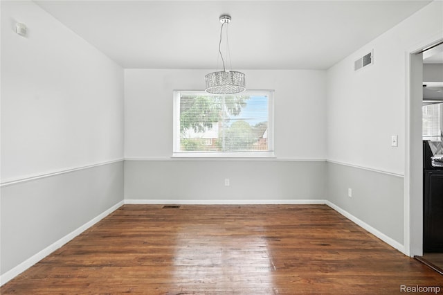 22679 Bell Brook St, Southfield, MI 48034 - unfurnished dining area featuring wood finished floors and a chandelier