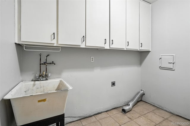 22679 Bell Brook St, Southfield, MI 48034 - laundry area with hookup for an electric dryer, cabinet space, and light tile patterned flooring