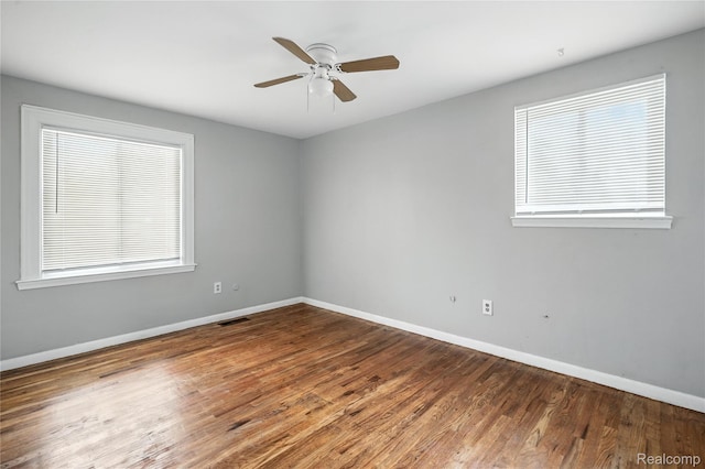 22679 Bell Brook St, Southfield, MI 48034 - spare room with a ceiling fan, plenty of natural light, and wood finished floors