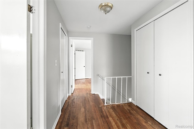 22679 Bell Brook St, Southfield, MI 48034 - hallway with an upstairs landing and dark wood finished floors