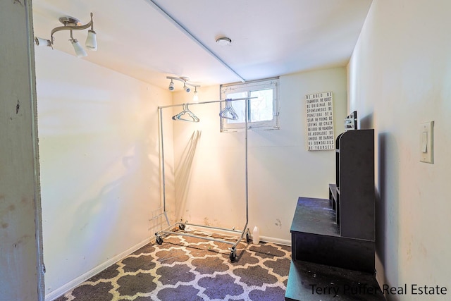 594 Oak Ave, Muskegon, MI 49442 - carpeted dining area with baseboards