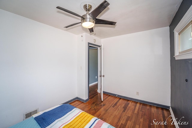 226 Elwell St SW, Grand Rapids, MI 49548 - unfurnished bedroom featuring wood finished floors and ceiling fan