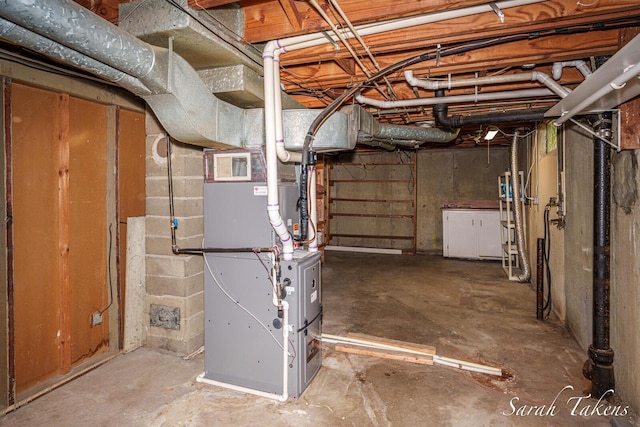 226 Elwell St SW, Grand Rapids, MI 49548 - unfinished basement featuring heating unit