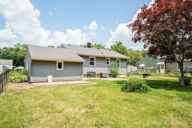 226 Elwell St SW, Grand Rapids, MI 49548 - rear view of property with a patio area, a chimney, and a shingled roof