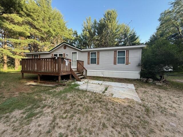 1422 E Monroe St, White Cloud, MI 49349 - back of property featuring a wooden deck