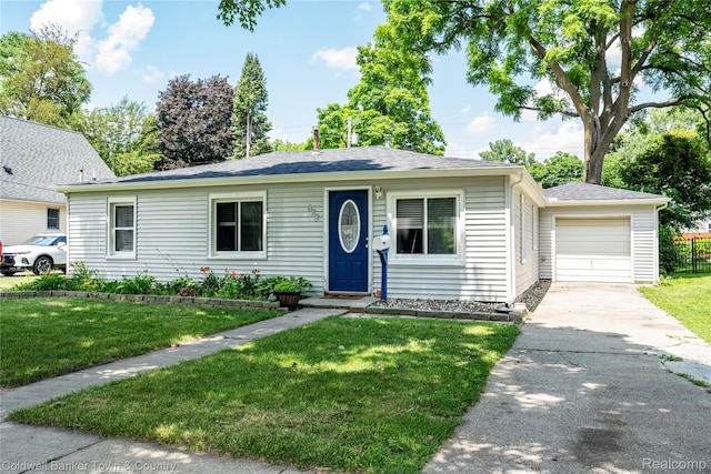 528 W Clinton St, Howell, MI 48843 - ranch-style home featuring an attached garage and driveway