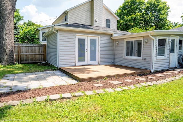 528 W Clinton St, Howell, MI 48843 - back of house featuring french doors and a patio area