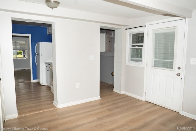 528 W Clinton St, Howell, MI 48843 - foyer with light wood-style flooring and baseboards