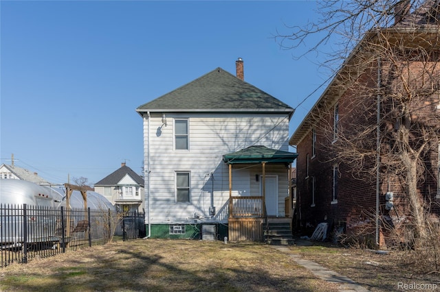 2547 Sheridan St, Detroit, MI 48214 - rear view of property featuring a chimney and a shingled roof