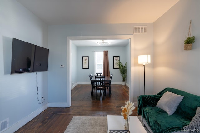 2547 Sheridan St, Detroit, MI 48214 - living area featuring wood finished floors and a chandelier