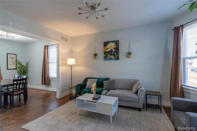 2547 Sheridan St, Detroit, MI 48214 - living room featuring a chandelier and wood finished floors