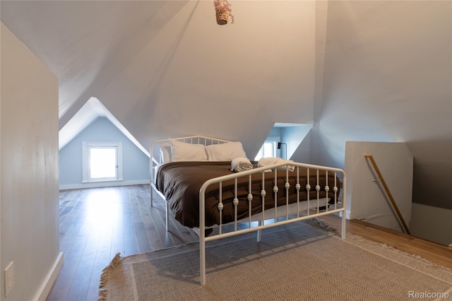 2547 Sheridan St, Detroit, MI 48214 - unfurnished bedroom featuring wood-type flooring and lofted ceiling