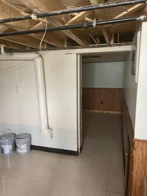 8645 Minock St, Detroit, MI 48228 - unfinished basement with wood walls and wainscoting