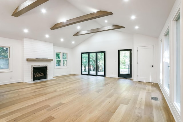 4046 Hillside Trl, New Buffalo, MI 49117 - unfurnished living room featuring beamed ceiling, light wood-type flooring, high vaulted ceiling, recessed lighting, and a fireplace
