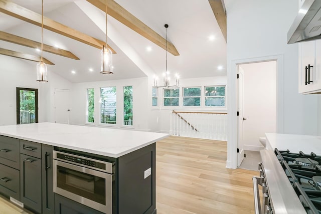 4046 Hillside Trl, New Buffalo, MI 49117 - kitchen featuring range hood, light wood-type flooring, healthy amount of natural light, pendant lighting, and recessed lighting