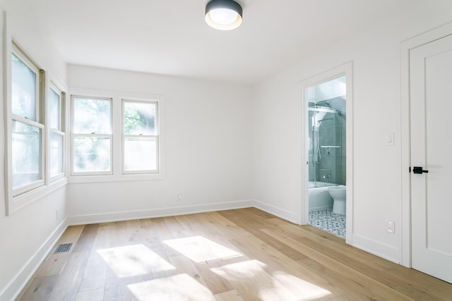 4046 Hillside Trl, New Buffalo, MI 49117 - unfurnished room with light wood-type flooring and baseboards