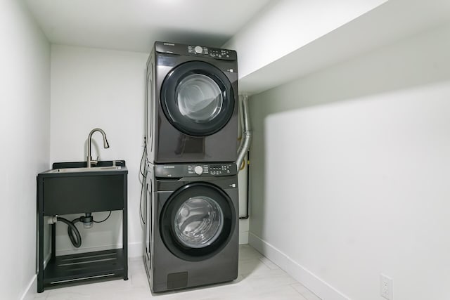 4046 Hillside Trl, New Buffalo, MI 49117 - washroom featuring stacked washer / drying machine and light marble finish flooring