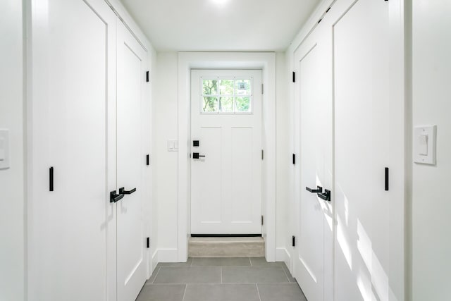 4046 Hillside Trl, New Buffalo, MI 49117 - doorway with light tile patterned flooring and baseboards