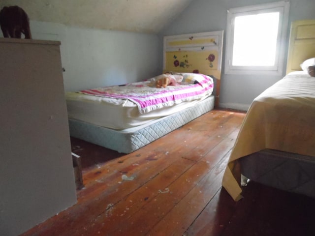 5294 Pinecrest, Prescott, MI 48756 - bedroom with hardwood / wood-style floors and lofted ceiling