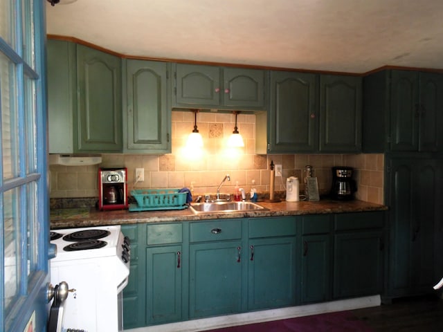 5294 Pinecrest, Prescott, MI 48756 - kitchen with green cabinetry, white electric range oven, and backsplash