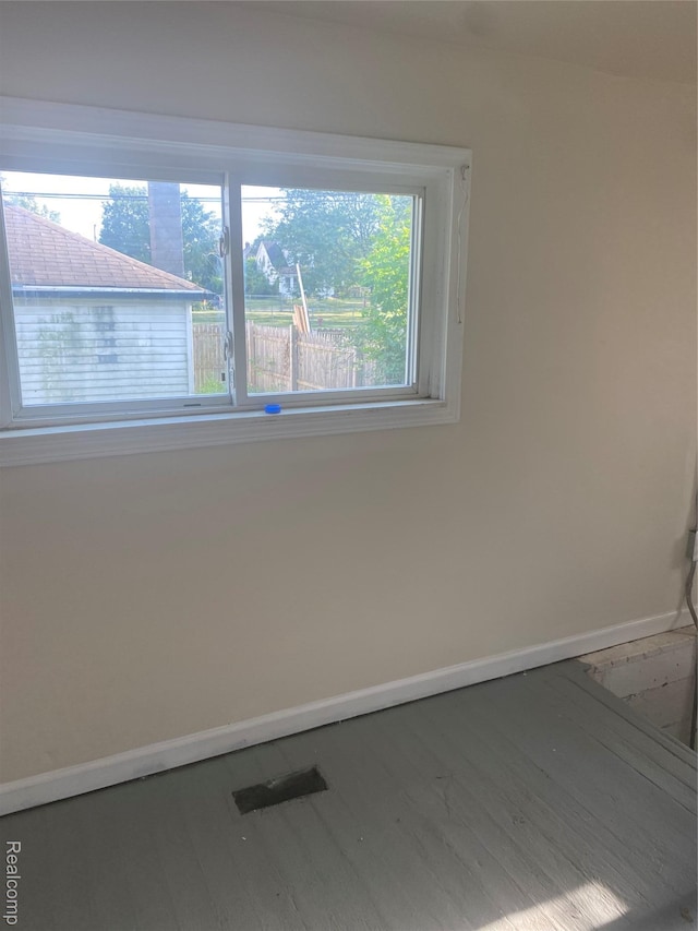 25 Marie St, Detroit, MI 48229 - unfurnished room featuring baseboards and wood finished floors