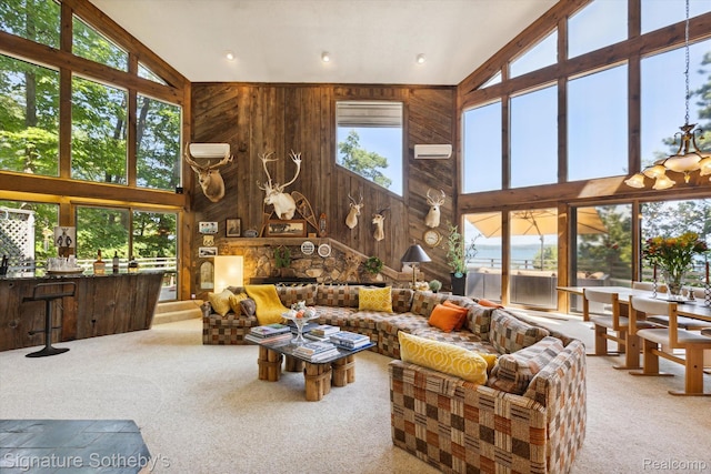 8641 Brettonwood Shores Rd, Rapid City, MI 49676 - living room with carpet flooring, high vaulted ceiling, and wood walls
