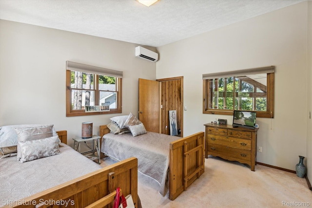8641 Brettonwood Shores Rd, Rapid City, MI 49676 - bedroom featuring a wall mounted AC, light carpet, and a textured ceiling