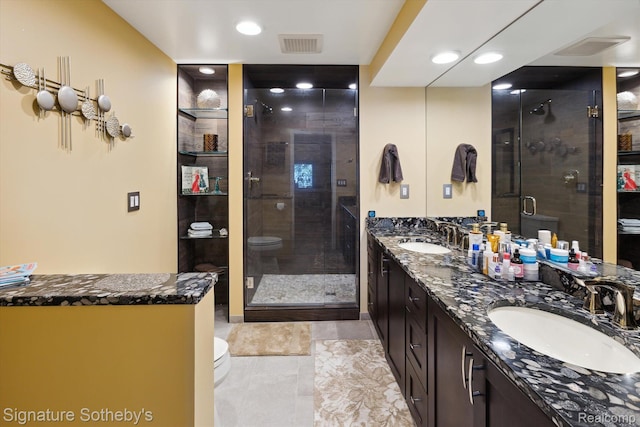 8641 Brettonwood Shores Rd, Rapid City, MI 49676 - full bathroom featuring double vanity, a shower stall, recessed lighting, and tile patterned flooring