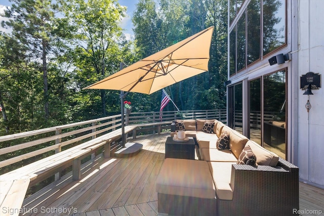 8641 Brettonwood Shores Rd, Rapid City, MI 49676 - wooden deck featuring outdoor lounge area and view of wooded area