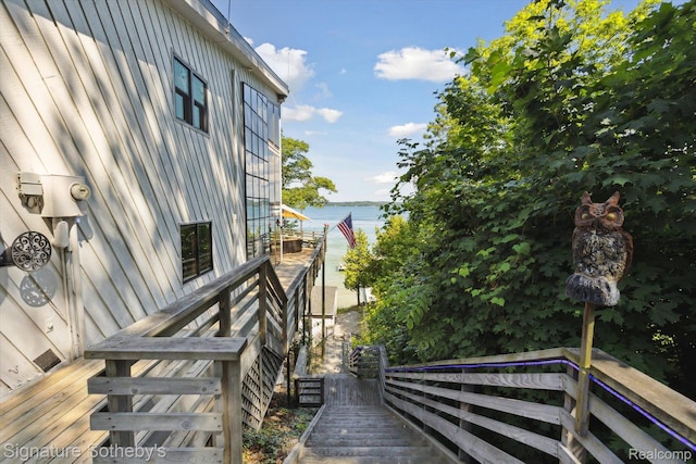 8641 Brettonwood Shores Rd, Rapid City, MI 49676 - view of property exterior featuring a water view