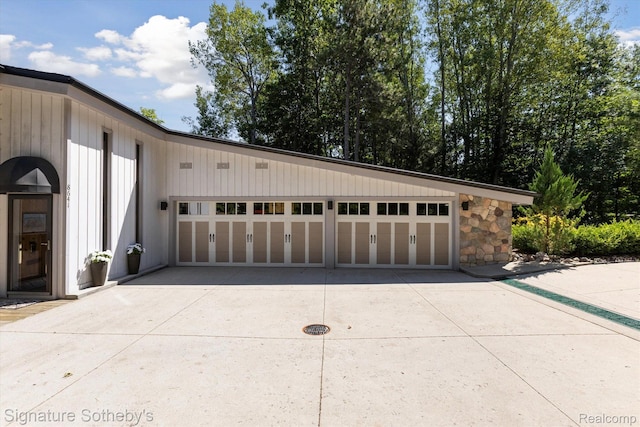 8641 Brettonwood Shores Rd, Rapid City, MI 49676 - garage featuring driveway