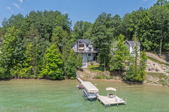 8641 Brettonwood Shores Rd, Rapid City, MI 49676 - dock featuring a yard