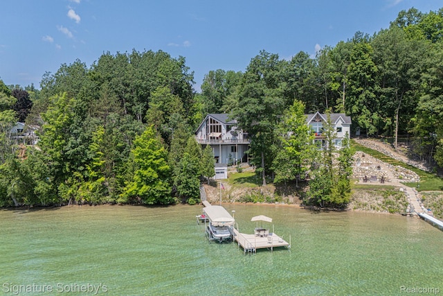 8641 Brettonwood Shores Rd, Rapid City, MI 49676 - dock area with a water view and a lawn