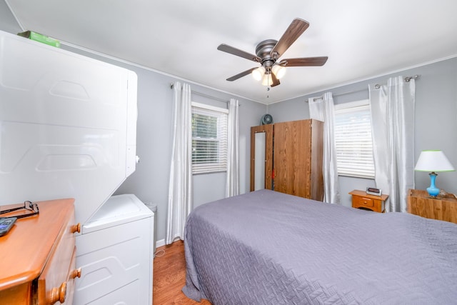 19336 E Chippewa Dr, Chippewa Lake, MI 49320 - bedroom with light wood finished floors, a ceiling fan, and crown molding